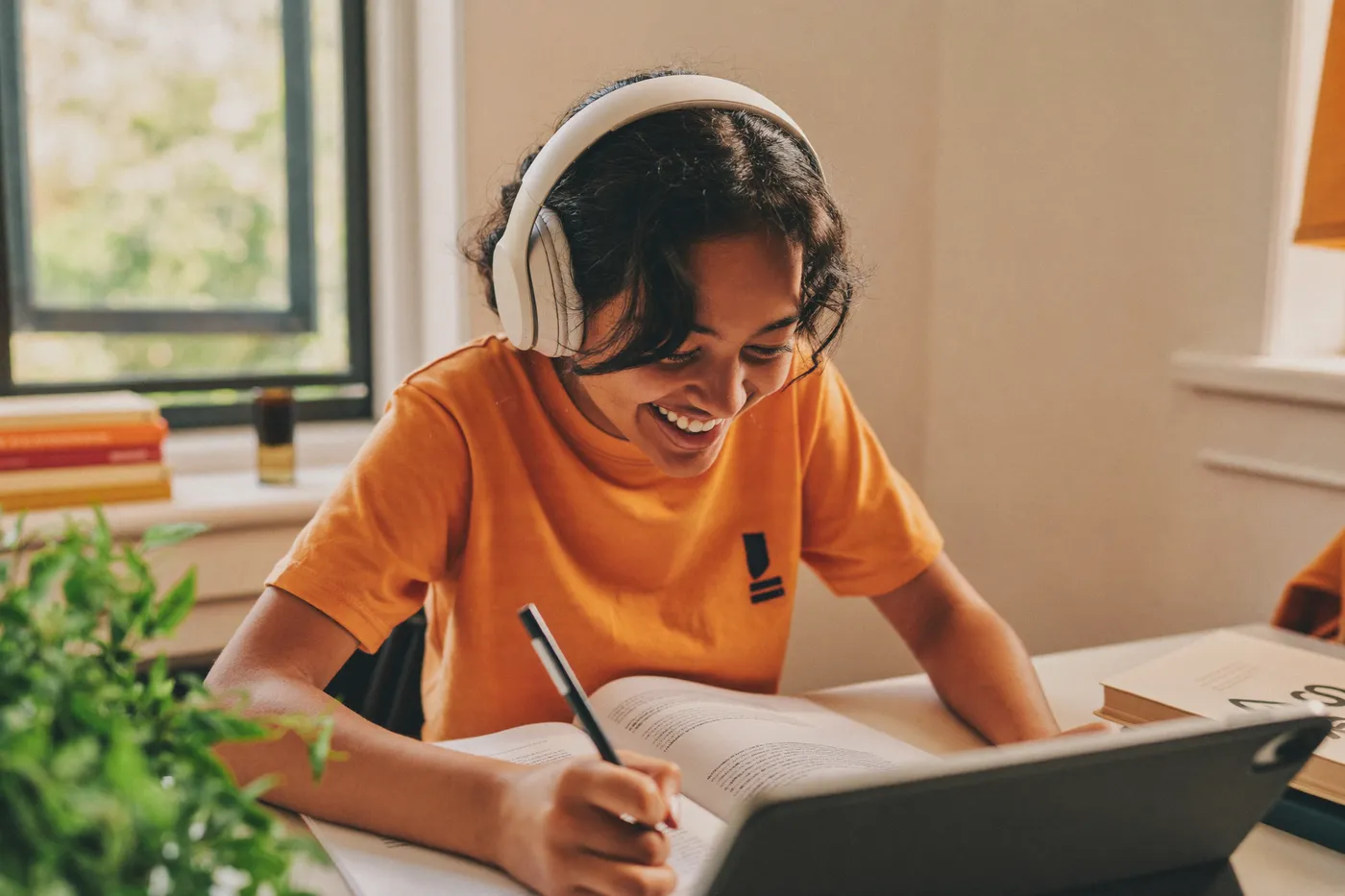 Student in headphones working through a lesson