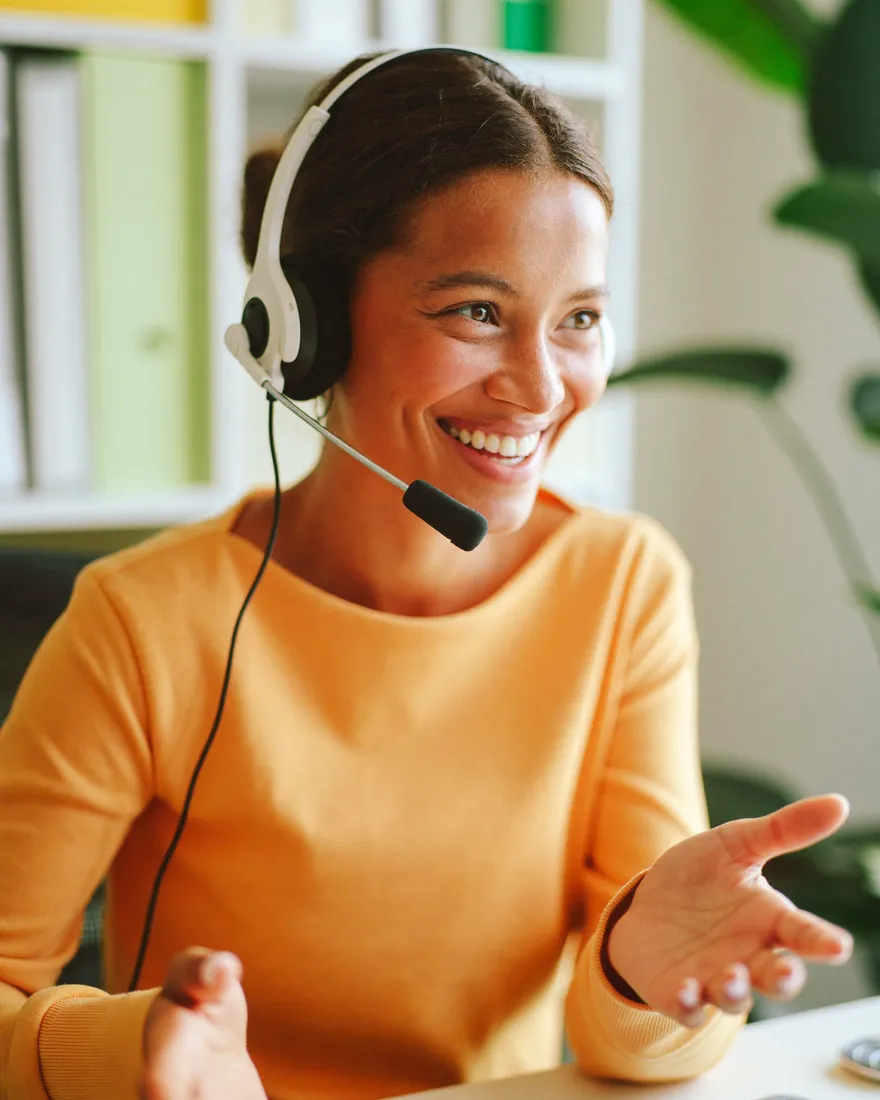 Support specialist wearing a headset mid-conversation